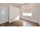 Bedroom featuring hardwood floors and a window with a blind at 12079 E Cortez Dr, Scottsdale, AZ 85259