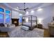 Main bedroom with a fireplace, large windows, and a comfortable seating area at 12079 E Cortez Dr, Scottsdale, AZ 85259