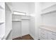 Walk-in closet featuring custom shelving and drawers for optimal storage at 12079 E Cortez Dr, Scottsdale, AZ 85259