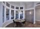 Bright dining room with a round table, and large windows at 12079 E Cortez Dr, Scottsdale, AZ 85259