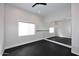 Bright exercise room featuring a large mirror wall, black flooring and a ceiling fan at 12079 E Cortez Dr, Scottsdale, AZ 85259