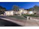 Beautiful two-story home with a three-car garage, lush landscaping, and a welcoming front entrance at 12079 E Cortez Dr, Scottsdale, AZ 85259