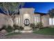 Elegant entryway with a grand double door and columns, surrounded by landscaping at 12079 E Cortez Dr, Scottsdale, AZ 85259