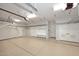 Bright, well-organized garage space with ample storage, shelving, and epoxy flooring at 12079 E Cortez Dr, Scottsdale, AZ 85259