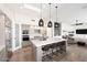 Open-concept kitchen with a large center island, pendant lights, and views of the living area at 12079 E Cortez Dr, Scottsdale, AZ 85259