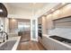 Kitchen showcases stainless steel appliances, marble countertops, and custom cabinetry at 12079 E Cortez Dr, Scottsdale, AZ 85259