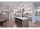Modern kitchen with large island, marble countertops, and stainless steel appliances at 12079 E Cortez Dr, Scottsdale, AZ 85259