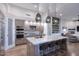 Modern kitchen with large island, marble countertops, and stainless steel appliances at 12079 E Cortez Dr, Scottsdale, AZ 85259