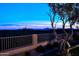 Landscaped backyard with mountain views at dusk at 12079 E Cortez Dr, Scottsdale, AZ 85259