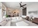 Open living space with modern furnishings, a fireplace, and seamless flow into the kitchen at 12079 E Cortez Dr, Scottsdale, AZ 85259