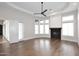 Spacious living room featuring a fireplace, hardwood floors, and recessed lighting at 12079 E Cortez Dr, Scottsdale, AZ 85259