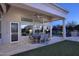 Outdoor patio dining area with access to the backyard at 12079 E Cortez Dr, Scottsdale, AZ 85259