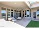 Covered patio with seating area, ceiling fan, and access to backyard at 12079 E Cortez Dr, Scottsdale, AZ 85259