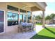 Covered patio with seating area, mountain views, and access to backyard at 12079 E Cortez Dr, Scottsdale, AZ 85259