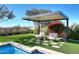Modern pergola with seating area overlooking the pool and stunning views at 12079 E Cortez Dr, Scottsdale, AZ 85259