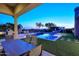 Stunning pool and patio area with a water slide at 12079 E Cortez Dr, Scottsdale, AZ 85259