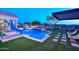 Blue pool with a waterslide and lounge chairs at 12079 E Cortez Dr, Scottsdale, AZ 85259