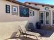 Relaxing patio with lounge chairs and southwestern-style artwork at 12979 W Roy Rogers Rd, Peoria, AZ 85383