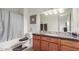 Bathroom with granite countertop and shower/tub combo at 1331 W Baseline Rd # 251, Mesa, AZ 85202