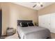 Main bedroom with King-size bed and private access to balcony at 1331 W Baseline Rd # 251, Mesa, AZ 85202