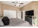 Bright bedroom with a large closet and TV at 1331 W Baseline Rd # 251, Mesa, AZ 85202