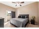 Main bedroom with King-size bed and private access to balcony at 1331 W Baseline Rd # 251, Mesa, AZ 85202