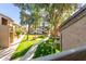 Community green space with walking path and mature trees at 1331 W Baseline Rd # 251, Mesa, AZ 85202