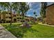 Community courtyard with seating and green space at 1331 W Baseline Rd # 251, Mesa, AZ 85202