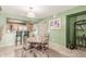 Open dining room with kitchen view and breakfast bar at 1331 W Baseline Rd # 251, Mesa, AZ 85202
