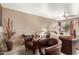 Spacious living room with two leather armchairs and fireplace at 1331 W Baseline Rd # 251, Mesa, AZ 85202