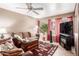 Comfortable living room featuring a cozy seating area and large TV at 1331 W Baseline Rd # 251, Mesa, AZ 85202