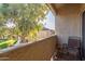 Relaxing patio with chair and view of lush green space at 1331 W Baseline Rd # 251, Mesa, AZ 85202