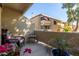 Private patio with wicker chair and small table at 1331 W Baseline Rd # 251, Mesa, AZ 85202