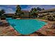 Relaxing community pool with stone deck and surrounding landscaping at 1331 W Baseline Rd # 251, Mesa, AZ 85202