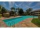 Large community pool with stone deck and shaded seating area at 1331 W Baseline Rd # 251, Mesa, AZ 85202