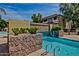 Community pool and waterfall feature with stone deck at 1331 W Baseline Rd # 251, Mesa, AZ 85202