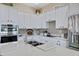 Modern kitchen with white cabinets, stainless steel appliances and a large island at 14231 N Desert Flower Dr, Fountain Hills, AZ 85268