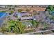 Aerial view of a community with shops and a house at 1458 S Kadota Dr, Gilbert, AZ 85296