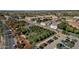 Aerial view of a community with a pond and trees at 1458 S Kadota Dr, Gilbert, AZ 85296