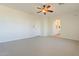 Spacious bedroom with ceiling fan and ensuite bathroom access at 14754 W Amelia Ave, Goodyear, AZ 85395