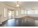 Spacious dining area with hardwood floors and sliding glass doors to patio at 14754 W Amelia Ave, Goodyear, AZ 85395