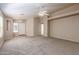 Spacious living room with neutral carpeting and high ceilings at 15144 W Washington St, Goodyear, AZ 85338