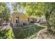 Large backyard with play structure and grass at 16364 W Roosevelt St, Goodyear, AZ 85338