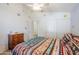 Bedroom with ceiling fan and southwestern decor at 16364 W Roosevelt St, Goodyear, AZ 85338