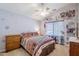 Bedroom with ceiling fan and southwestern bedding at 16364 W Roosevelt St, Goodyear, AZ 85338