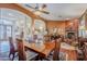 Open dining area with hardwood floors and view to living room at 16364 W Roosevelt St, Goodyear, AZ 85338