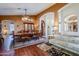 Spacious dining room featuring hardwood floors and a large wooden table at 16364 W Roosevelt St, Goodyear, AZ 85338