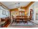 Bright dining area with hardwood floors and a large wooden table at 16364 W Roosevelt St, Goodyear, AZ 85338