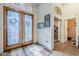 Spacious entry with double doors and view into home office at 16364 W Roosevelt St, Goodyear, AZ 85338