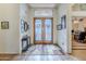 Bright entryway with double doors and stained glass window at 16364 W Roosevelt St, Goodyear, AZ 85338